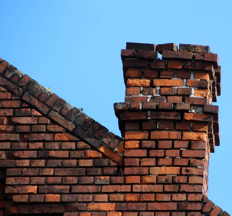 Signs Your Van Nuys Home Needs a Chimney Inspection Damaged chimney on an Van Nuys home showing cracks and missing mortar